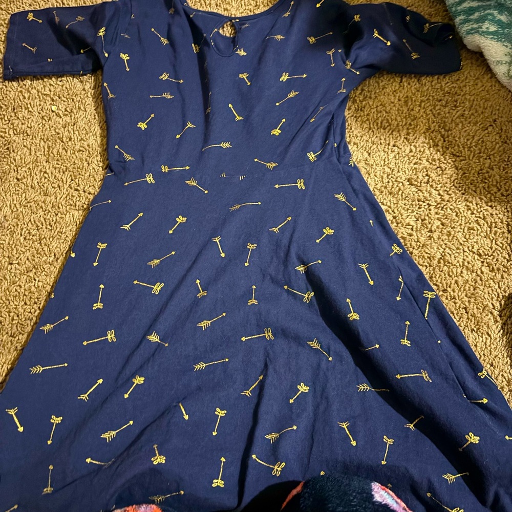 Navy blue with arrows on the dress